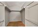 Walk-in closet featuring hardwood floors, white walls and metal shelving at 3283 W 102Nd Pl, Westminster, CO 80031