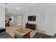 Finished basement with TV, coffee table, carpeted floor and neutral paint at 944 E Lily Ct, Highlands Ranch, CO 80126