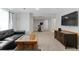 Large finished basement with TV, seating, carpeted floor, and exercise equipment at 944 E Lily Ct, Highlands Ranch, CO 80126