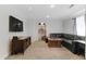 Finished basement with plush carpeting, cozy seating, and plenty of room for recreation at 944 E Lily Ct, Highlands Ranch, CO 80126