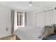 Bright bedroom with closet space, neutral walls, and lots of light at 944 E Lily Ct, Highlands Ranch, CO 80126