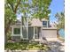 Charming two-story home with a well-manicured lawn, mature trees and a two car garage at 944 E Lily Ct, Highlands Ranch, CO 80126