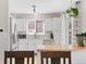 Bright kitchen with stainless steel appliances, white cabinets, and a butcher block counter, perfect for cooking at 944 E Lily Ct, Highlands Ranch, CO 80126
