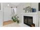 Inviting entryway featuring a fireplace, tiled floors, and direct access to the front door at 944 E Lily Ct, Highlands Ranch, CO 80126