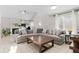 Bright living room with a large sectional sofa, fireplace, and natural light at 944 E Lily Ct, Highlands Ranch, CO 80126