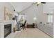 Bright and airy living room with fireplace, vaulted ceilings, and plenty of natural light at 944 E Lily Ct, Highlands Ranch, CO 80126
