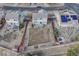 Aerial view of a home with a spacious backyard, deck, and privacy fence at 18668 E Vassar Dr, Aurora, CO 80013