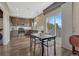 Cozy kitchen with stainless steel appliances and access to a deck through sliding glass doors at 18668 E Vassar Dr, Aurora, CO 80013