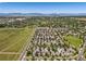 Aerial view showcasing the community's layout, green spaces, and proximity to the mountains at 12427 James Ct, Broomfield, CO 80020