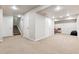 Spacious unfinished basement with neutral carpet, white walls, and multiple closets for storage at 12427 James Ct, Broomfield, CO 80020