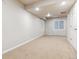 Large basement featuring carpet, white walls, recessed lighting, and a door to the outside at 12427 James Ct, Broomfield, CO 80020