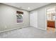 Cozy bedroom with neutral walls, soft carpet and closet for optimal storage at 12427 James Ct, Broomfield, CO 80020