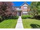 Beautiful two-story home with well-manicured lawn and a welcoming front entrance at 12427 James Ct, Broomfield, CO 80020