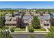 Charming two-story home with lush landscaping, a well-manicured lawn, and classic architectural details at 12427 James Ct, Broomfield, CO 80020