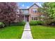 Charming two-story home with manicured lawn and inviting walkway leading to the front door at 12427 James Ct, Broomfield, CO 80020