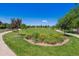 Landscaped community green space with lush lawns, walking paths, and vibrant flower beds at 12427 James Ct, Broomfield, CO 80020