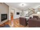 The living room features a fireplace, hardwood floors, and seamless access to the kitchen at 12427 James Ct, Broomfield, CO 80020
