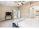 The main bedroom features soft carpet, neutral walls, and seamless access to the bathroom at 12427 James Ct, Broomfield, CO 80020