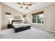 Spacious main bedroom with plenty of natural light, soft carpet and a ceiling fan at 12427 James Ct, Broomfield, CO 80020