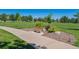 Community park with walking paths, a bench for relaxing, and a meticulously maintained lawn at 12427 James Ct, Broomfield, CO 80020