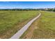 Scenic view of the community walking path surrounded by open space and the distant mountains at 12427 James Ct, Broomfield, CO 80020