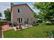 Expansive backyard with a patio area, manicured lawn, mature landscaping, and privacy fence at 13441 Cherry St, Thornton, CO 80241