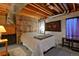Finished basement bedroom with plush bedding, accent rugs, and ambient lighting for cozy retreat at 13441 Cherry St, Thornton, CO 80241