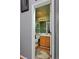 Half bathroom featuring wood floors, oak cabinets and a mirror at 13441 Cherry St, Thornton, CO 80241