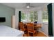 Eat-in kitchen area with wooden table and chairs, large windows, and a ceiling fan at 13441 Cherry St, Thornton, CO 80241