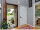 Entryway with wood floors and views of bathroom and front yard at 13441 Cherry St, Thornton, CO 80241