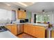 Bright kitchen featuring stainless steel appliances and a sunlit dining area at 13441 Cherry St, Thornton, CO 80241