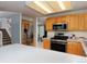 Updated kitchen features stainless steel appliances, light wood cabinetry, and lots of natural light at 13441 Cherry St, Thornton, CO 80241
