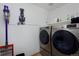 A well-equipped laundry room with modern, front-loading washer and dryer for convenient chores at 13441 Cherry St, Thornton, CO 80241