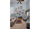 High ceilings, lots of artwork and large windows make this a bright, cozy living room at 13441 Cherry St, Thornton, CO 80241
