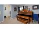 Inviting living room featuring an organ, neutral walls, and a carpeted floor at 13441 Cherry St, Thornton, CO 80241