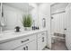 Modern bathroom with double sinks, white marble countertop, black fixtures, and a view of the shower at 693 Penn Rd, Elizabeth, CO 80107