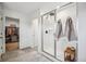 Bathroom with a glass-enclosed shower, decorative towels, and tile flooring, adjoining the walk-in closet at 693 Penn Rd, Elizabeth, CO 80107