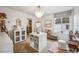 Stylish dressing room with vanity table, chandelier, and a large mirror, offering a luxurious space at 693 Penn Rd, Elizabeth, CO 80107