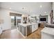 Bright kitchen and island open to the living room at 693 Penn Rd, Elizabeth, CO 80107