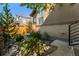 Landscaped backyard with a stone pathway and lush greenery at 48 Newport St, Denver, CO 80230