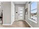 Light and airy entryway with hardwood floors and a modern door at 48 Newport St, Denver, CO 80230