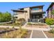 Two-story modern home with landscaped yard and covered patio at 48 Newport St, Denver, CO 80230