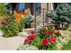 Landscaped area showcasing flowers and shrubs near the home's entrance at 48 Newport St, Denver, CO 80230