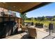 Covered patio with seating area and Weber grill at 48 Newport St, Denver, CO 80230