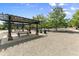 Park with picnic tables under pergola and grassy areas at 48 Newport St, Denver, CO 80230