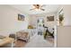 This is a well-lit bedroom featuring a window and neutral walls and carpet at 3550 S Harlan St # 335, Denver, CO 80235