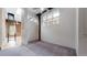 Spacious bedroom features large windows, a ceiling fan, and neutral carpet at 1510 Wazee St # 3, Denver, CO 80202