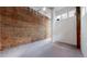 Bright bedroom featuring carpet, brick wall, and high ceilings at 1510 Wazee St # 3, Denver, CO 80202