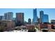 Urban skyline featuring diverse architectural styles and high-rise buildings under a clear blue sky at 1510 Wazee St # 3, Denver, CO 80202