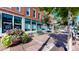 Storefront exterior on a brick building with flower planter and bench at 1510 Wazee St # 3, Denver, CO 80202